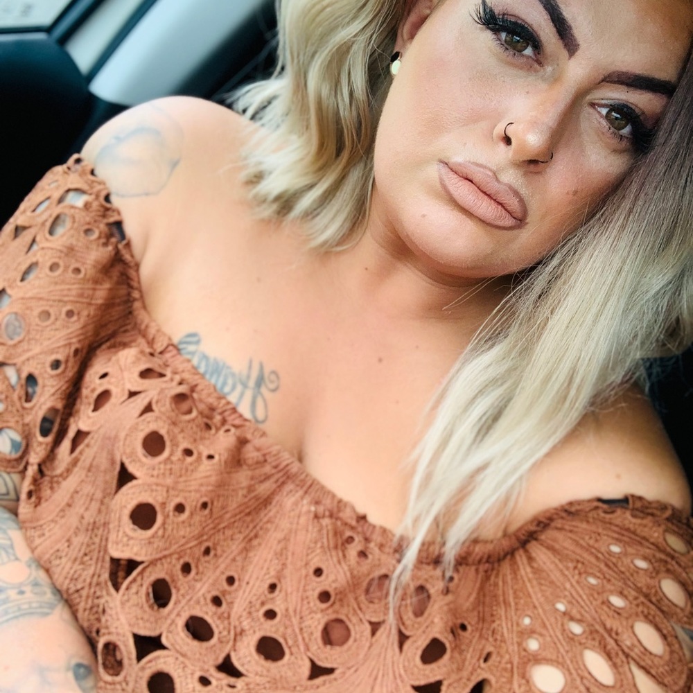 Brown sleeveless jumpsuit with belt